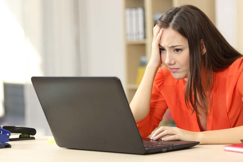 worries woman on laptop