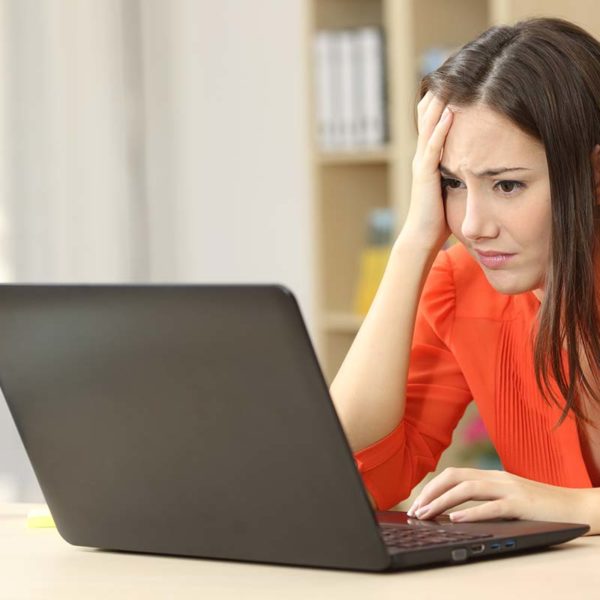 worries woman on laptop