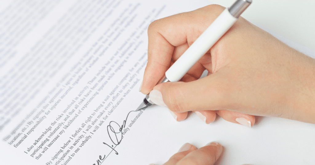 Employer signing legal employment contract with non-solicitation clauses for workforce protection.