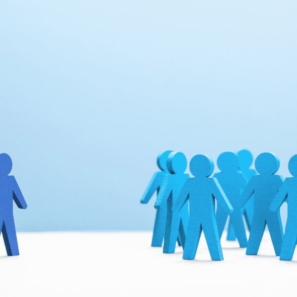 A lone blue figure stands apart from a group, symbolizing false discrimination claims at work.