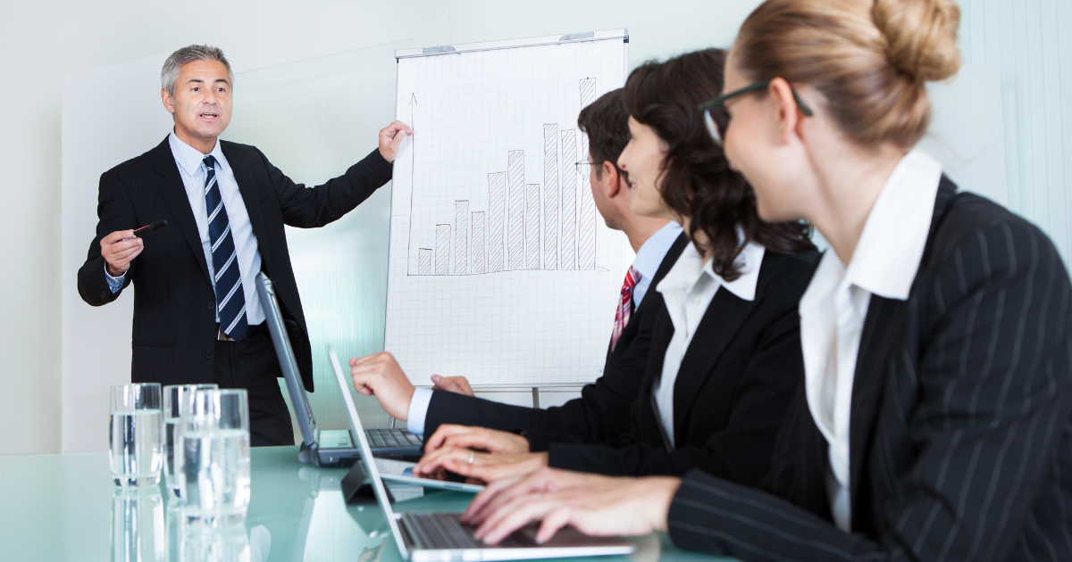 Employees attending a compliance training session on workplace education laws