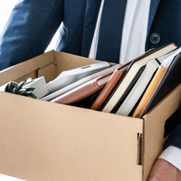 Employee facing termination meeting in Tennessee workplace, exploring wrongful termination without discrimination options