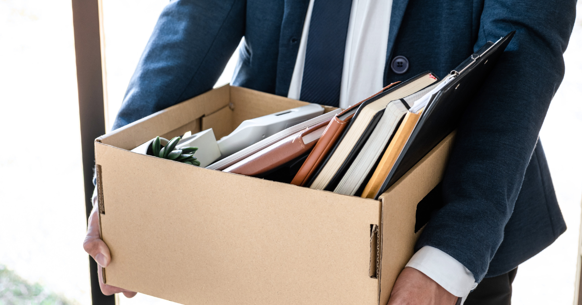 Employee facing termination meeting in Tennessee workplace, exploring wrongful termination without discrimination options